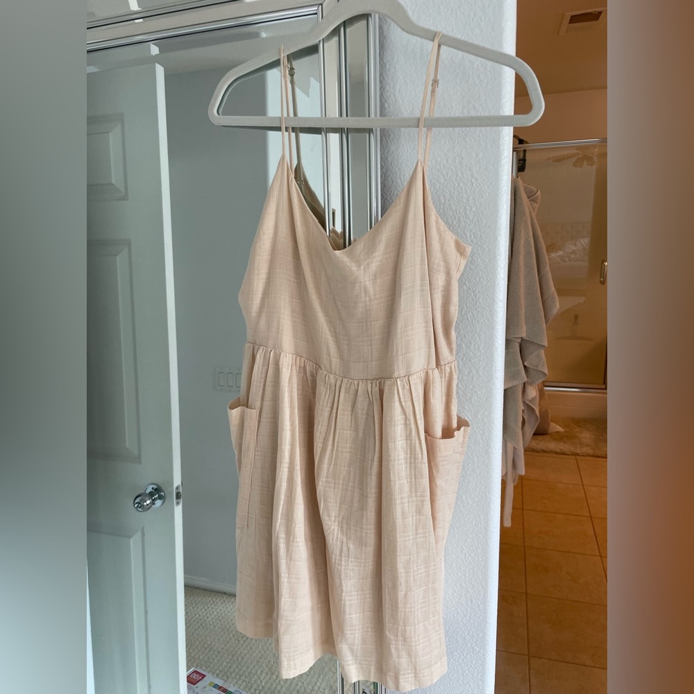Brand new, never worn, tags still on Mahina babydoll dress size S with pockets!
